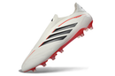 Chuteira Adidas Copa Pure IV Elite FG - Born For Goals Pack em cor branca e detalhes vermelhos.