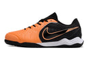 Chuteira Futsal Tiempo 10 Legend Elite IC Laranja e Preta lateral em fundo branco