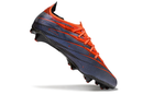 Chuteira Puma Ultra 5 FG, modelo preto e laranja, ideal para performance em campo.