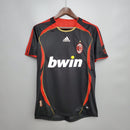 Camisa AC Milan 2006 Retro Preta Olimpíada com detalhes em vermelho e logo Adidas.
