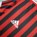 AC Milan Away 11/12 Retro Red Olympic com listras vermelhas e pretas, detalhe do logo adidas.