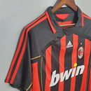 Camisa AC Milan Home 06/07 Retro OLYMPIC em preto e vermelho com detalhes em dourado.