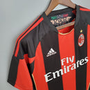 Camiseta AC Milan 10/11 Retro Olympic com a logo Adidas e patrocinador Fly Emirates.