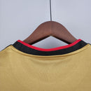 Gola da camisa AC Milan Third 13/14 Retro Yellow com detalhes em vermelho e preto.