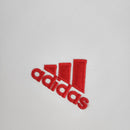 Logo vermelho da adidas em tecido branco, parte do uniforme AC Milan Away 11/12 Retro White.