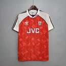 Camisola Arsenal Home 90/92 na OLYMPIC STORE, modelo retro, destacando logotipo JVC e detalhes em vermelho.
