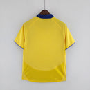 Camisola Arsenal Home 93/94 Retro amarela com gola azul, celebrando a história do clube.