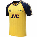 Camisa Arsenal Retro 1988/1989 da loja olímpica, com logo JVC e design icônico amarelo e azul.