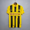 Camisa Borussia Dortmund Home 12/13 Retro com listras amarelas e pretas, logo da Puma e patrocinador Evonik.