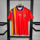 Camisola Espanha GK 1994 Retro exposta em um cabide, destacando o design vibrante e a marca Adidas.