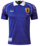 Camisola Japão Home 1998 Retro com detalhes em azul e logo da JFA, ideal para colecionadores de camisetas de futebol.