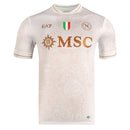 Camisola Napoles alternativo branca 2025/26 com detalhes em dourado e logo do Napoli.