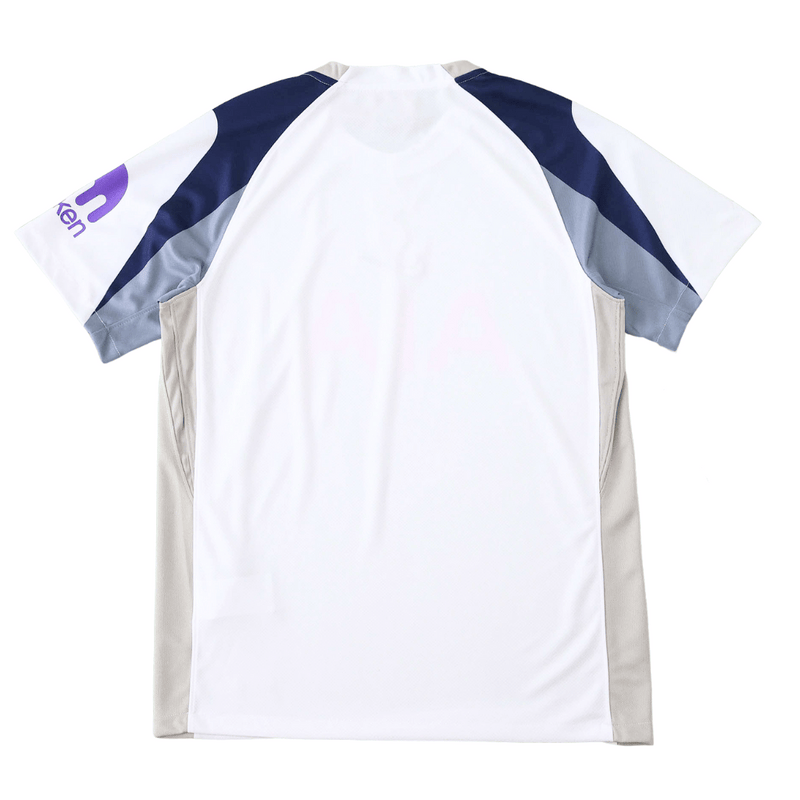 Camisola do Tottenham Hotspur Principal 2025–2026, branca com detalhes em azul-marinho e cinzento, escudo centralizado e design moderno da Nike.