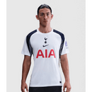 Camisola do Tottenham Hotspur Principal 2025–2026, branca com detalhes em azul-marinho e cinzento, escudo centralizado e design moderno da Nike.