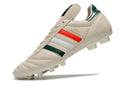 Chuteira Adidas Copa Mundial FG Bege, Vermelha e Preta com design tricolor e solado para gramado natural.