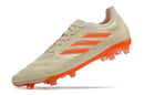 Chuteira Adidas Copa Pure+ FG Laranja em destaque, mostrando design vibrante e tecnologia avançada para desempenho em campo.