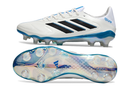 Chuteira Adidas Copa Pure III Elite FG - Branca e Azul vistas lateral e inferior com detalhes de sola e design moderno.
