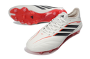 Chuteira Adidas Copa Pure IV Elite FG - Born For Goals Pack em branco e vermelho, ideal para performance em campo.