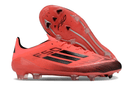 Chuteira Adidas F50.1 FG Laranja e Preto, design moderno para performance e conforto no futebol.