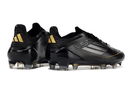 Chuteira Adidas F50.1 FG Preta - design preto elegante com detalhes em dourado, ideal para desempenho em campos naturais.