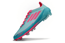 Chuteira Adidas f50 Elite FG - Azul e Rosa, destacando design vibrante e tecnologia para desempenho no futebol.