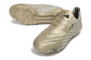 Chuteira Adidas F50 Elite FG Spider Dourada, modelo exclusivo de futebol com design luxuoso e tecnologia avançada.