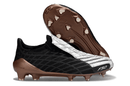 Chuteira Adidas F50 Elite FG Spider Preta e Branca com detalhes em bronze, ideal para futebolistas que buscam desempenho.
