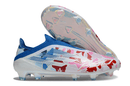 Chuteira Adidas F50 FG Elite Ed. "Bape" vista lateral com detalhes de design colorido.