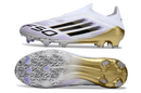 Chuteira Adidas F50 FG Elite Dourada com design elegante e sola de tração aprimorada.
