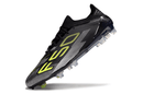 Chuteira Adidas F50 FG Elite Preta e Amarela em destaque, mostrando design moderno e performance em campo.