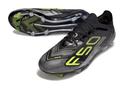 Chuteira Adidas F50 FG Elite Preta e Amarela com design arrojado e solado para performance no campo.