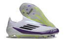 Chuteira Adidas F50 LL FG Branca, Roxa e Preto com detalhes em verde e tecnologia FG para desempenho em campo.