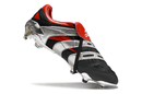Chuteira Adidas Predator Accelerator FG - Preta e Vermelha em detalhes com design elegante e moderno.