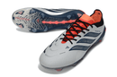 Chuteira Adidas Predator Elite FG 26 - "Finishers Steel" com design inovador e tecnologia avançada para controle no futebol.