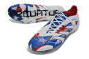 Chuteira Adidas Predator Elite FG - Branca e Azul com detalhes em vermelho e azul, ideal para jogadores que buscam performance.