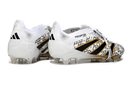 Chuteira Adidas Predator Elite FG Tongue Branca e Dourada com design elegante em preto e dourado.