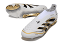Chuteira Adidas Predator Elite FG - Branca e Dourada "Teamgeist" com design icônico e tecnologia de ponta.
