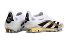 Chuteira Adidas Predator Elite FG - Branca e Dourada "Teamgeist" com detalhes em preto e dourado.