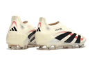Chuteira Adidas Predator Elite FG Laceless Bege e Preta, design sofisticado e sem cadarço para desempenho em campo.
