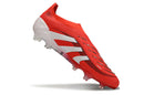Chuteira Adidas Predator Elite FG Laceless - Vermelha e Branca em angulação, destacando design inovador e sem cadarço.
