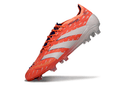 Chuteira Adidas Predator Elite FG - Laranja com design icônico e sola otimizada para campo de futebol.