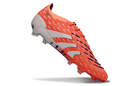 Chuteira Adidas Predator Elite FG - Laranja em destaque, ideal para controle e precisão no futebol.