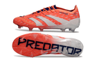 Chuteira Adidas Predator Elite FG - Laranja com design vibrante e sola FG para controle em campos de futebol.