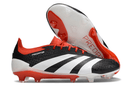 Chuteira Adidas Predator Elite FG - Preta, Branca e Laranja em destaque com design moderno e tricolor vibrante.