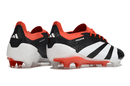 Chuteira Adidas Predator Elite FG - Preta, Branca e Laranja vista traseira com design energético e tecnologia avançada.