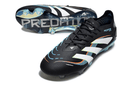 Chuteira Adidas Predator Elite FG - Preta e Azul em destaque, mostrando design e tecnologia avançada para controle no campo.