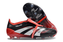 Chuteira Adidas Predator Elite FG Tongue Preta e Vermelha com design moderno e tecnologia avançada.