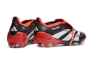 Chuteira Adidas Predator Elite FG Tongue Preta e Vermelha com design arrojado e tecnologia avançada para campo.
