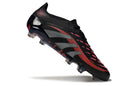 Chuteira Adidas Predator Elite FG - Preta e Vermelha em ângulo, destacando seu design e cores vibrantes.