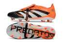 Chuteira Adidas Predator Elite FG Tongue Preta e Laranja com design inovador e tecnologia avançada.